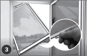 A hand removes an insect net screen using a tab, with an outdoor view visible through the open window.