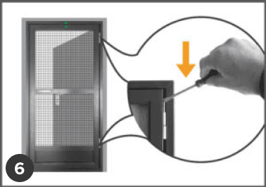 A hand uses a screwdriver to adjust a screw on the edge of a swing insect screen door during installation, shown in close-up.