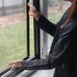 A person slides up the glass, revealing the Insect screen window – in frame.